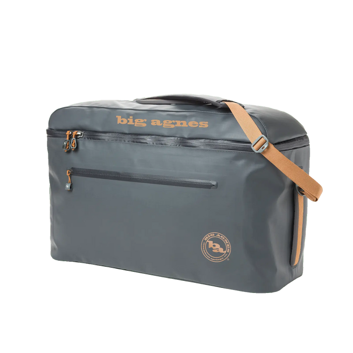 The Big Agnes Big Joe Gear Duffel is a gray heavy-duty bag with tan accents, a top handle, adjustable shoulder strap, front zipper pocket, and "big agnes" printed in tan on top.