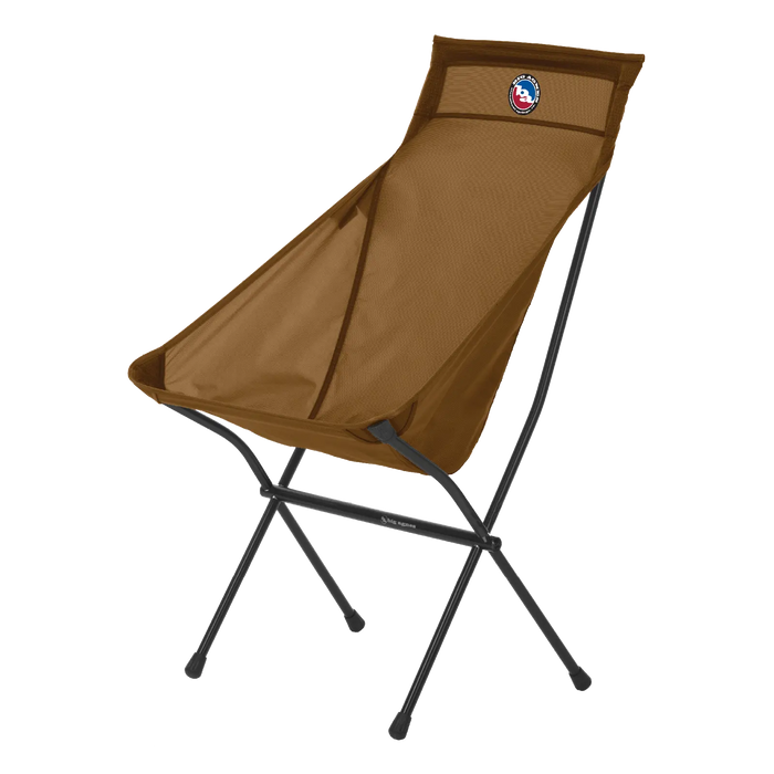 The Big Agnes Big Six Camp Chair is a lightweight brown portable chair with a tall mesh back, black metal frame, round logo patch on the upper backrest, sling-style seat, and four sturdy legs.