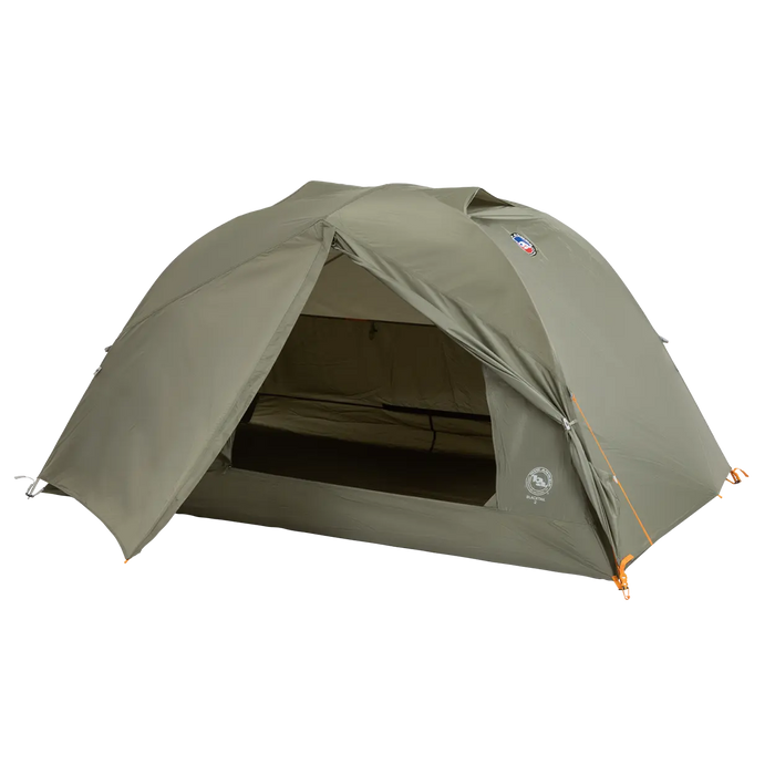 A green, dome-shaped Big Agnes Blacktail 2 - Vetiver tent is pitched with its front entrance open to reveal the interior. This lightweight backpacking tent stands on a plain white background.