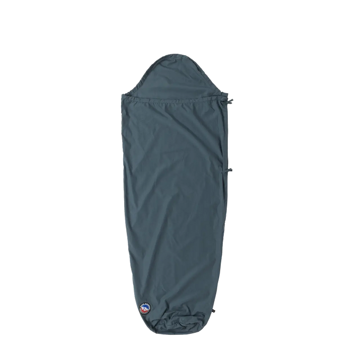 The Big Agnes Cotton Sleeping Bag Liner is shown in gray with a hood, full-length, and tapered design against a white background, featuring the logo near the bottom—perfect as a travel companion for your sleeping bag.