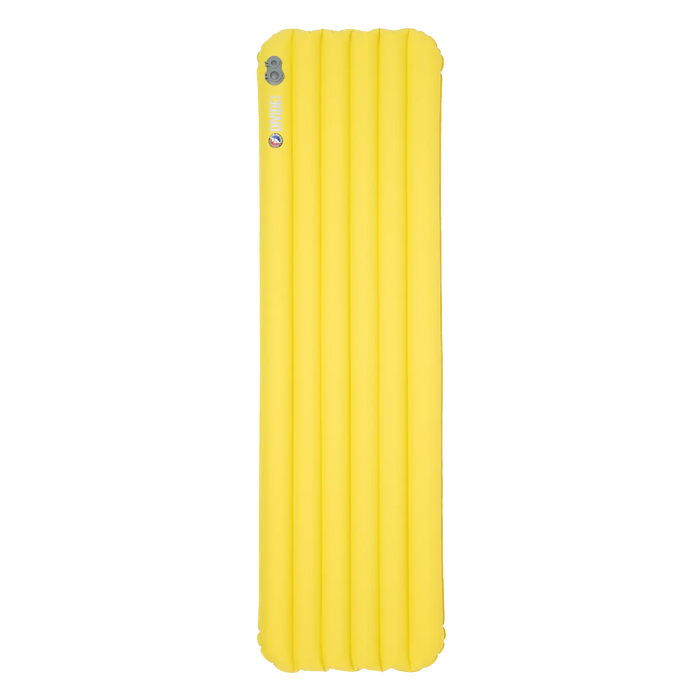 The Big Agnes Divide Insulated is a bright yellow, lightweight rectangular sleeping pad with horizontal air chambers, crafted from recycled fabric and shown from above on a white background.