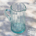 maison berber - recycled glass jug on white table - winter's moon