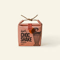 Chocolate shake pack with branding on a white background