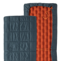 Two sections of a sleeping bag, one blue quilted and one orange inflatable, on a white background.