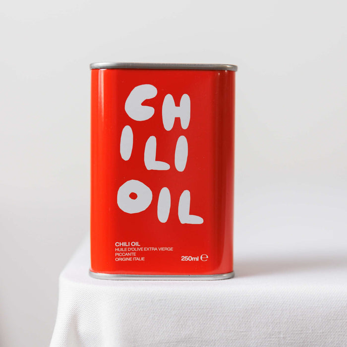 olea pia - italian chili oil tin on white background - winter's moon