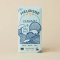Meurisse caramel and sea salt chocolate bar packaging on a beige background