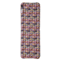 Multicolored inflatable camping pad on a white background