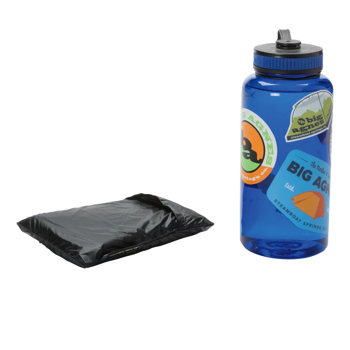 The Big Agnes String Ridge VST 1.5 Footprint, a black folded ground cloth, is placed beside a blue reusable water bottle with stickers on a white background.