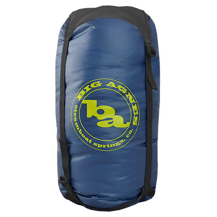 The Superlight Girdle by Big Agnes is a blue cylindrical stuff sack with black straps, ideal for gear storage, and features the yellow Big Agnes Steamboat Springs, CO logo on the side.