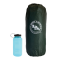 A dark green Big Agnes Tent Stuff Sack 7”x20” stands upright next to a blue water bottle with a black cap, both set against a plain white background.