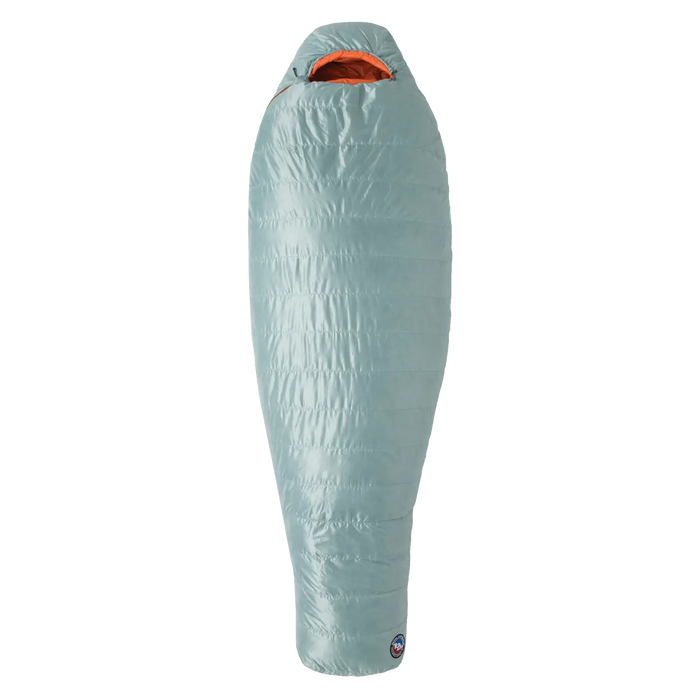 The Big Agnes Women's Greystone 30°, a light blue sleeping bag with 650 fill DownTek insulation and an orange interior, stands upright on a plain white background.