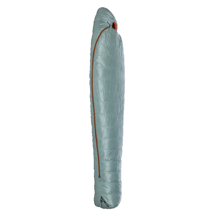 The Big Agnes Women's Greystone 30° mummy-style sleeping bag in light blue-grey with an orange side zipper stands upright against a plain white background.