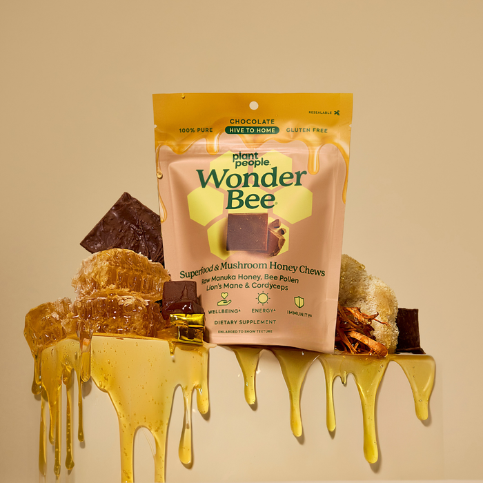 Plant People Wonder Bee honey chews packaging with honey drizzling around on a beige background