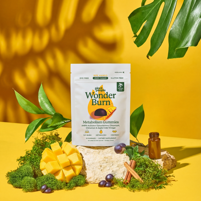 Wonder Burn supplement package on a yellow background with green leaves
