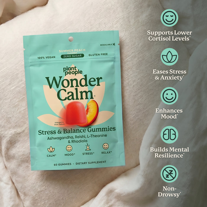 Plant People Wonder Calm Stress & Balance Gummies pouch in peach flavor, displayed on a soft white fabric background with green benefit callouts on the right.