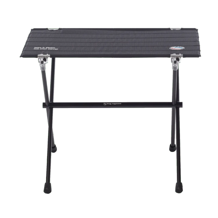 The Big Agnes Woodchuck Camp Table is a compact, foldable black table with metal legs, shown from above on a white background. Its textured top displays small logos in two corners—perfect for outdoor adventures.